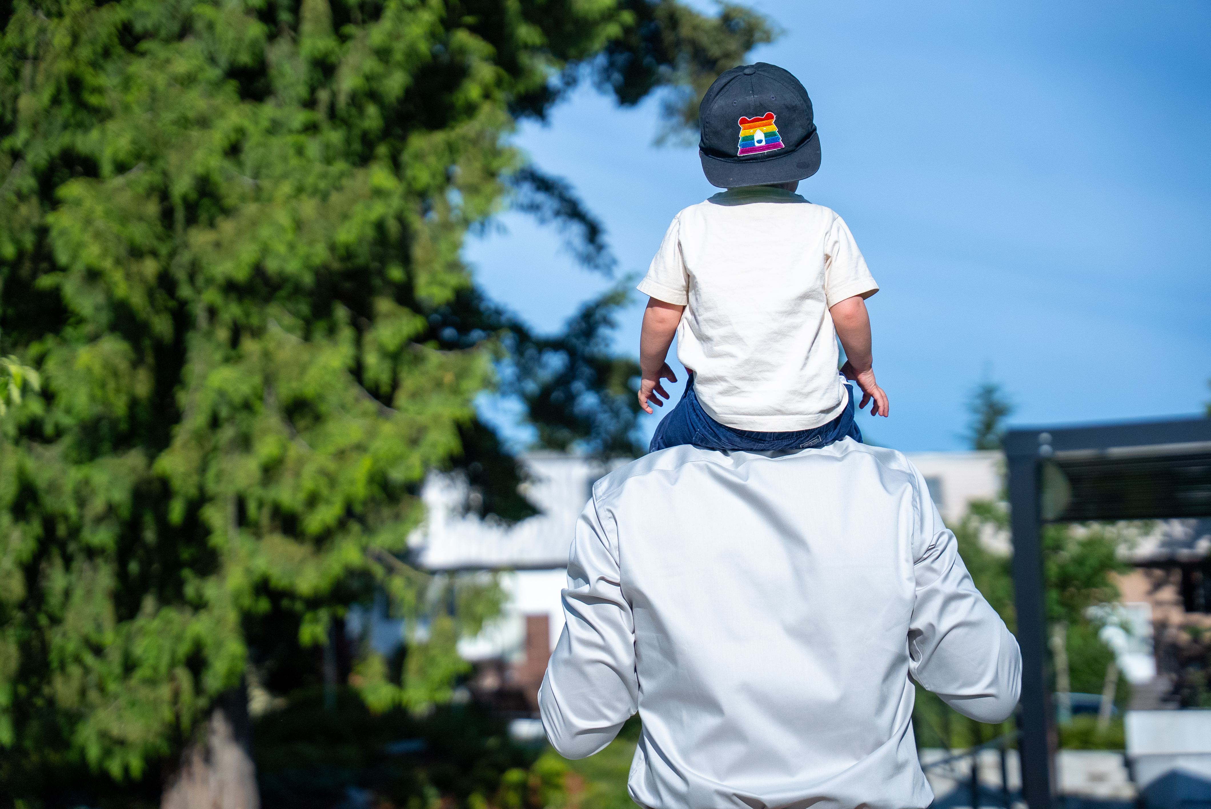 Man carrying toddler on shoulders